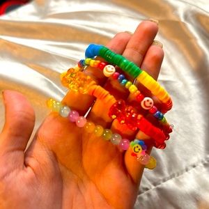 Four. Pack rainbow, bracelets.